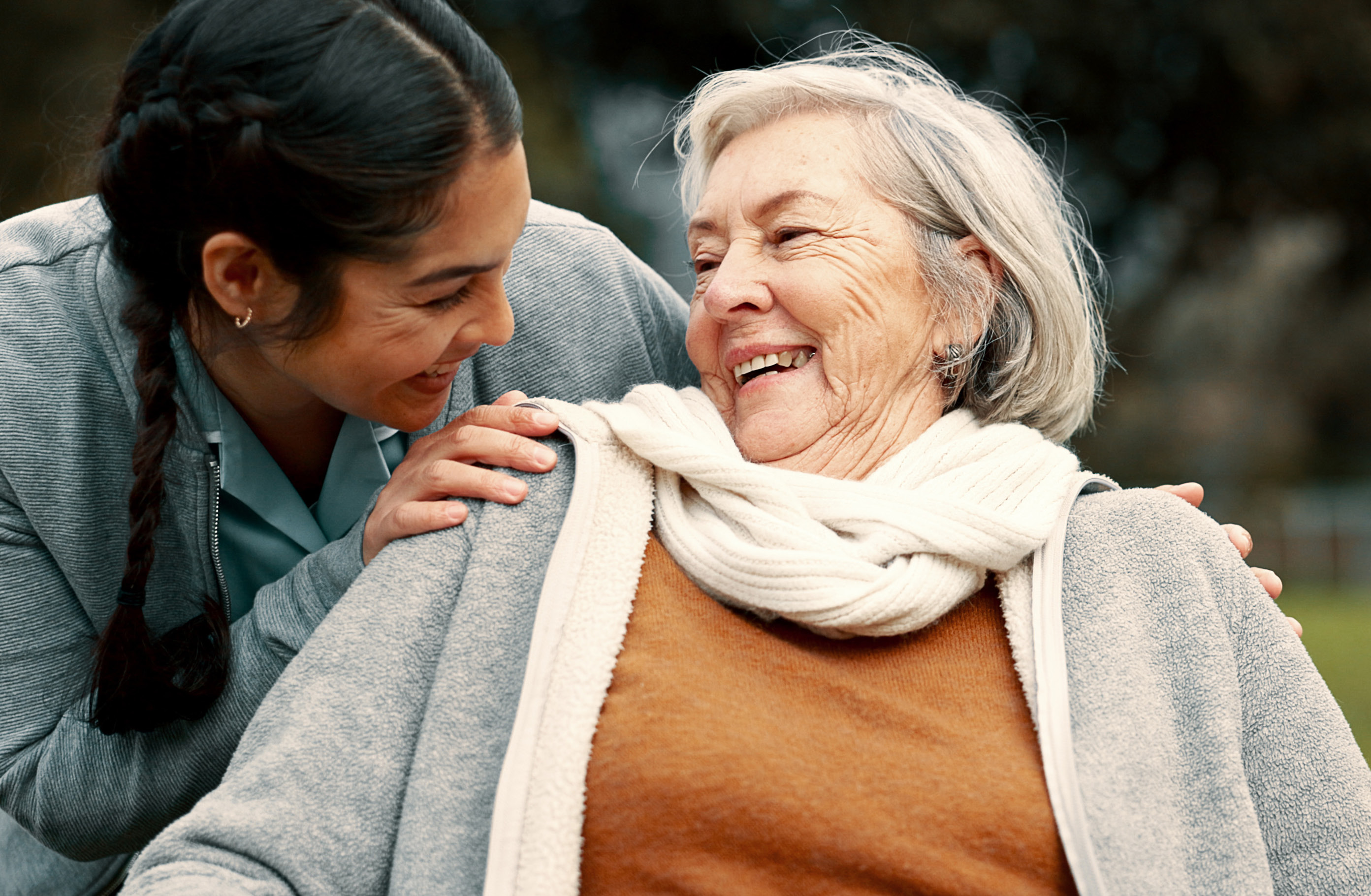 A carer and a smiling older woman together